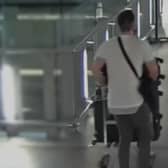 Craig Bramall, 42, from Abram, was caught on CCTV footage at the airport with suitcases of cash