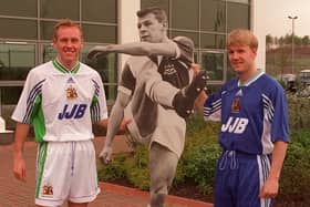 Life sized cut out of Latics chairman Dave Whelan with players Ian Kilford and Kevin Sharp and the Wigan Athletic new home and away kits.
