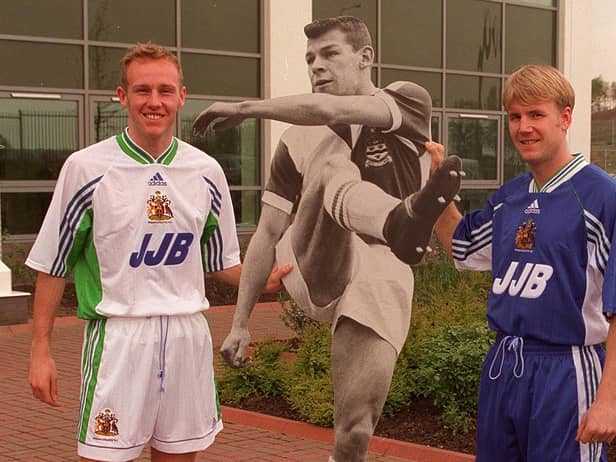Life sized cut out of Latics chairman Dave Whelan with players Ian Kilford and Kevin Sharp and the Wigan Athletic new home and away kits.