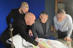 Artists Al and Al show the Haigh Hall masterplan to Coun Chris Ready and James Winterbottom, Wigan Council's director of digital, leisure and well-being