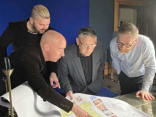 Artists Al and Al show the Haigh Hall masterplan to Coun Chris Ready and James Winterbottom, Wigan Council's director of digital, leisure and well-being