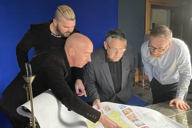 Artists Al and Al show the Haigh Hall masterplan to Coun Chris Ready and James Winterbottom, Wigan Council's director of digital, leisure and well-being