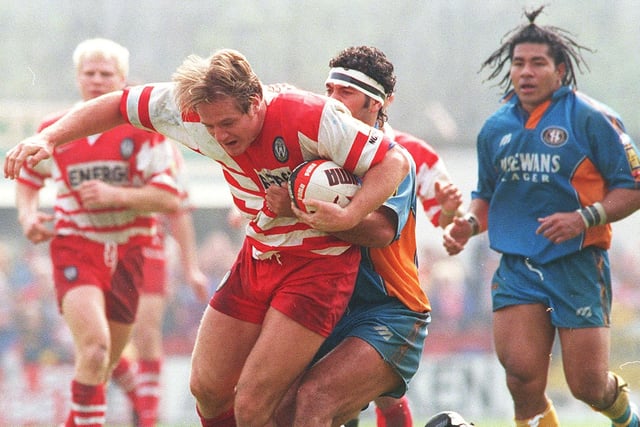 WIGAN WARRIORS V ST HELENS - LAST GOOD FRIDAY DERBY AT CENTRAL PARK.
BATTLE OF THE BIG WIGS:  Simon Haughton runs into Kevin Iro and Feretti Tuilagi.