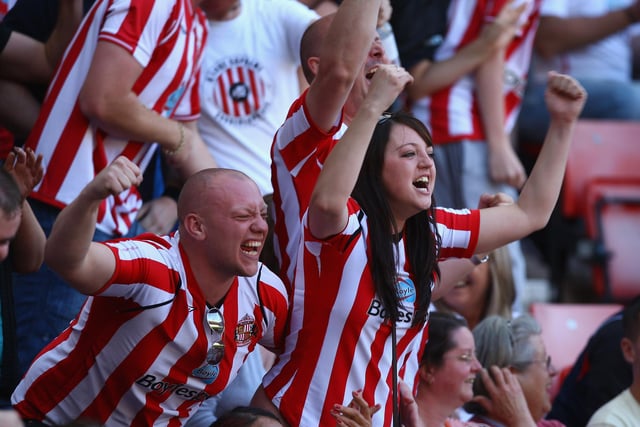 Sunderland fans react after hearing that Newcastle United are losing during the Premier League match between Sunderland and Chelsea at The Stadium of Light on May 24, 2009.