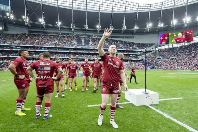 Liam Farrell waves to family and friends at the end of Wigan's warm-up.