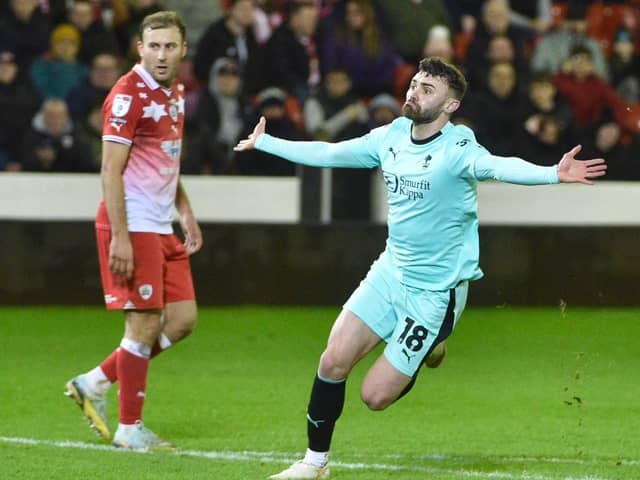 Jonny Smith enjoys his equalising goal at Barnsley in front of the away end