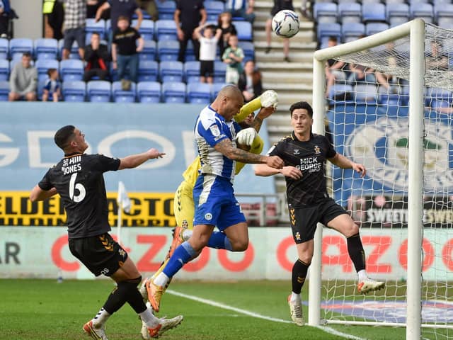 Josh Magennis tries to get the ball over the line