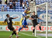 Josh Magennis tries to get the ball over the line