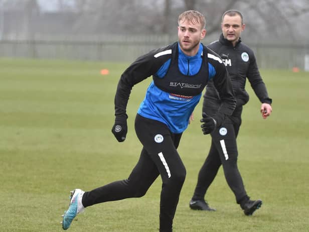 Shaun Maloney watches over Jack Whatmough in training