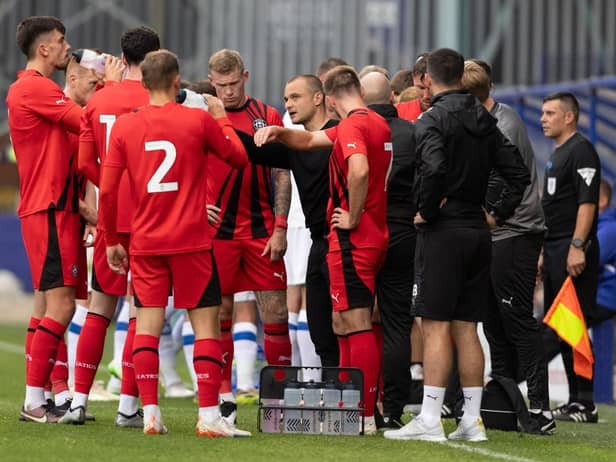 Shaun Maloney gets the message across to his Latics players at Tranmere