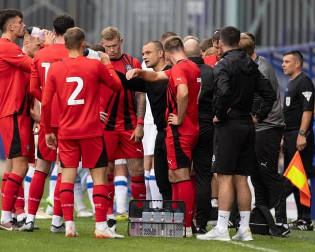 Shaun Maloney gets the message across to his Latics players at Tranmere