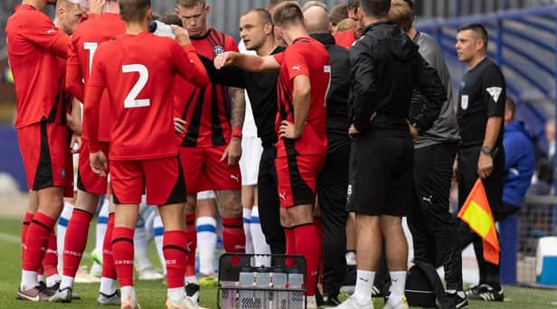 Shaun Maloney gets the message across to his Latics players at Tranmere