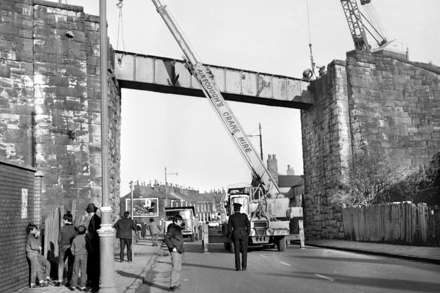 The demolition of the century old Tippings railway bridge on Poolstock Lane in January 1971.The bridge carried the old Pemberton loop line.