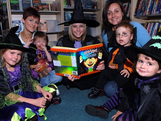 Ashton Library holds a themed Halloween reading day for toddlers. Pictured with library assistant Louise Hartley, centre, are Niamh, Carrie Knox with daughter Faith, Toni Lewis with son Robert and Grace