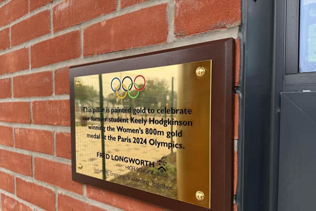 The new gold plaque outside Fred Longworth High School in honour of Keely Hodgkinson