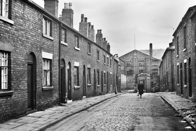 The Brown and Haigh clothing factory at the end of Wood Street, Wigan, in the 1960s.
Billy Davies, Wigan's well known gay man, who worked as an attendant at the Ritz cinema for many years, lived in the street and used to berate the workers for walking over his newly mopped front.