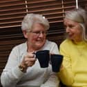 Members of the community enjoy a brew, biscuit, watch tv and chat at the first Warm and Cosy event, held every Wednesday 1pm to 3.30pm at St Judes Social Club, Poolstock, Wigan.