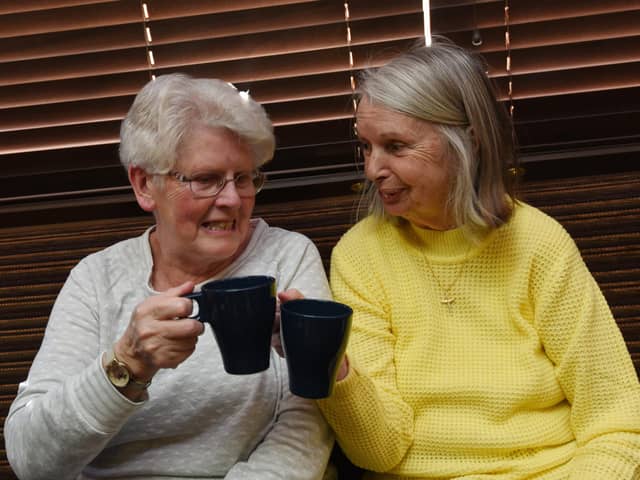 Members of the community enjoy a brew, biscuit, watch tv and chat at the first Warm and Cosy event, held every Wednesday 1pm to 3.30pm at St Judes Social Club, Poolstock, Wigan.