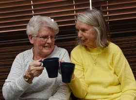 Members of the community enjoy a brew, biscuit, watch tv and chat at the first Warm and Cosy event, held every Wednesday 1pm to 3.30pm at St Judes Social Club, Poolstock, Wigan.