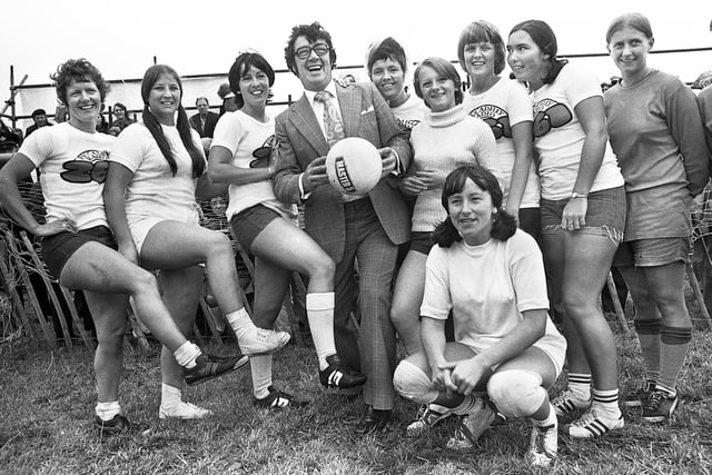 Television comedian Frank Carson with one of the teams competing in an "It's a Knockout" tournament on Bank Holiday Monday 29th of August 1977.
The competition based on the popular television programme at the time involved teams from around the Wigan area taking part in sporty type activities which usually involved getting soapy and wet.