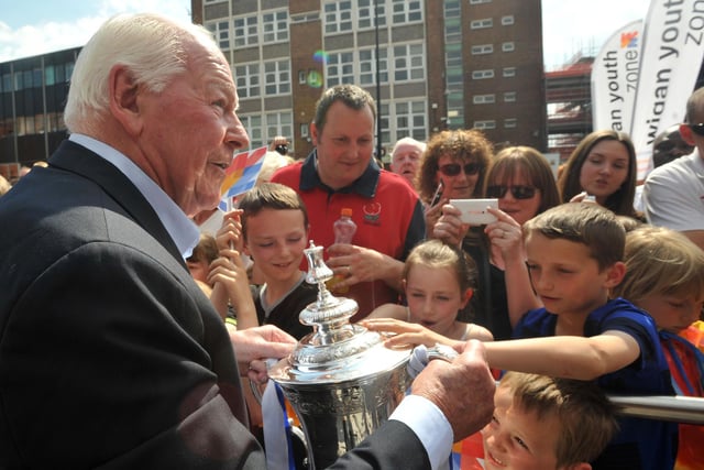 WYZ life president Dave Whelan lets fans touch the FA Cup