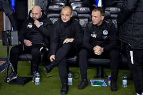 Shaun Maloney and assistants Max Rogers and Glenn Whelan take in the midweek win over Northampton