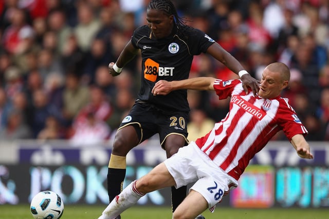 Andy Wilkinson of Stoke slides in to tackle Hugo Rodallega of Wigan during the Barclays Premier League match between Stoke City and Wigan Athletic at Britannia Stadium on May 22, 2011 in Stoke on Trent, England.