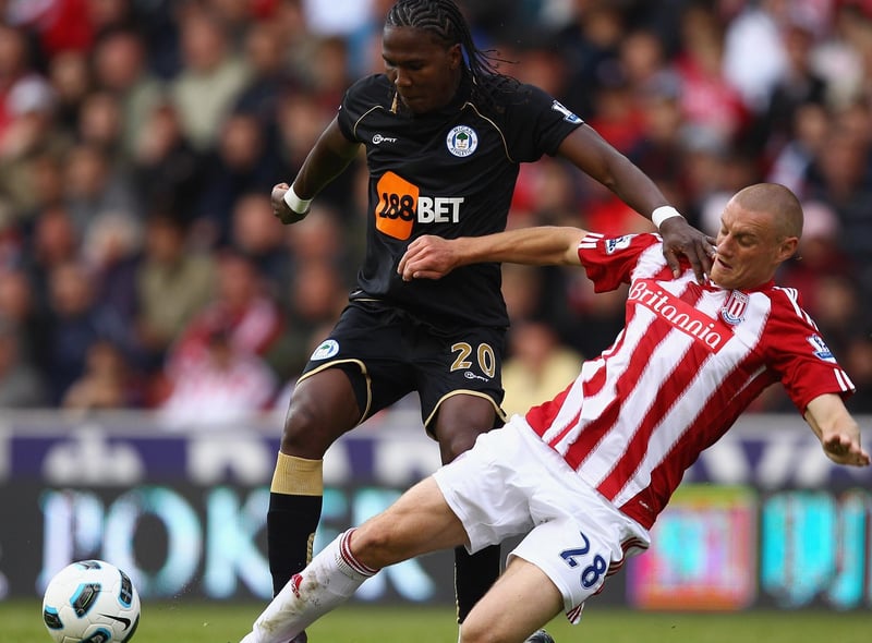 Andy Wilkinson of Stoke slides in to tackle Hugo Rodallega of Wigan during the Barclays Premier League match between Stoke City and Wigan Athletic at Britannia Stadium on May 22, 2011 in Stoke on Trent, England.