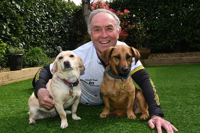 David pictured with his dogs Heidi and Leon