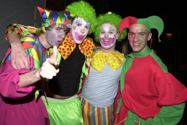 Clowning around as the fancy dress party unfolds along Wigan's King St on Boxing Day night 2004.