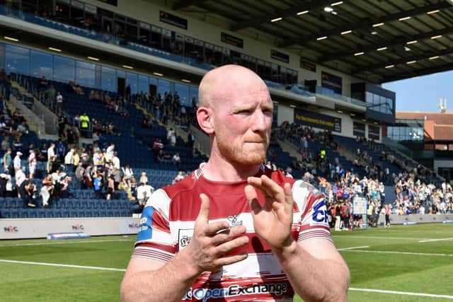 Liam Farrell applauds the Wigan Warriors fans following the victory over Leeds Rhinos