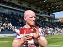 Liam Farrell applauds the Wigan Warriors fans following the victory over Leeds Rhinos
