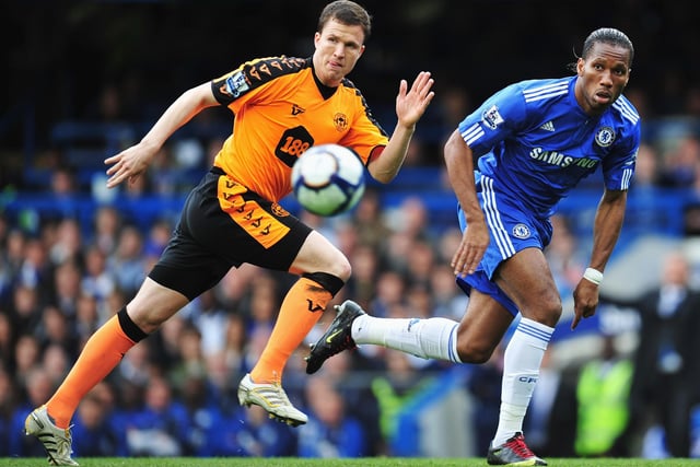 Gary Caldwell of Wigan Athletic chases Didier Drogba of Chelsea during the Barclays Premier League match between Chelsea and Wigan Athletic at Stamford Bridge on May 9, 2010 in London, England.