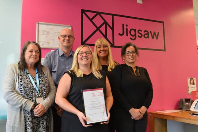 Staff at Jigsaw with the accreditation