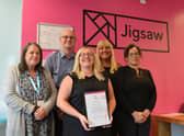 Staff at Jigsaw with the accreditation