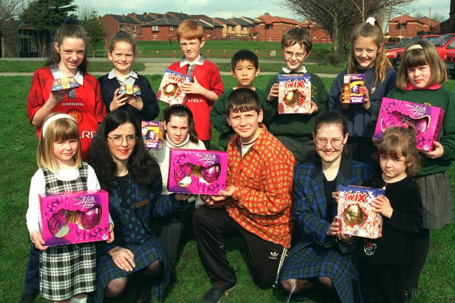 Artistic youngsters from St Patricks R. c School Hardybutts  Wigan who were presented with early Easter eggs from the Royal Bank of Scotland. Mandy Harris (left  and  Claire Moore (right) together with all the winners from the Easter competition