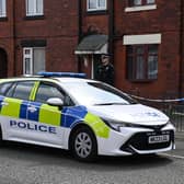 Police at the scene at a property on Crankwood Road, Abram, after two houses in Wigan were raided in a counter-terrorism investigation.