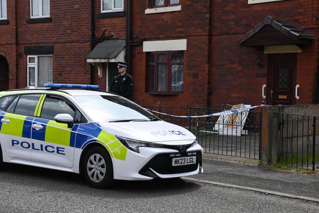 Police at the scene at a property on Crankwood Road, Abram, after two houses in Wigan were raided in a counter-terrorism investigation.