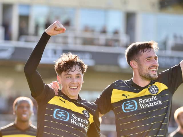 Luke Chambers is congratulated by team-mate James Carragher after scoring at Bristol Rovers