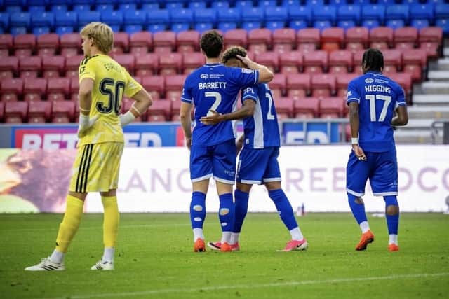 K'Marni Miller takes the congratulations of Connor Barrett after opening the scoring
