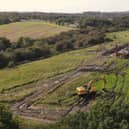 Excavators on land near the M58/M6 junction and St James's rugby fields
