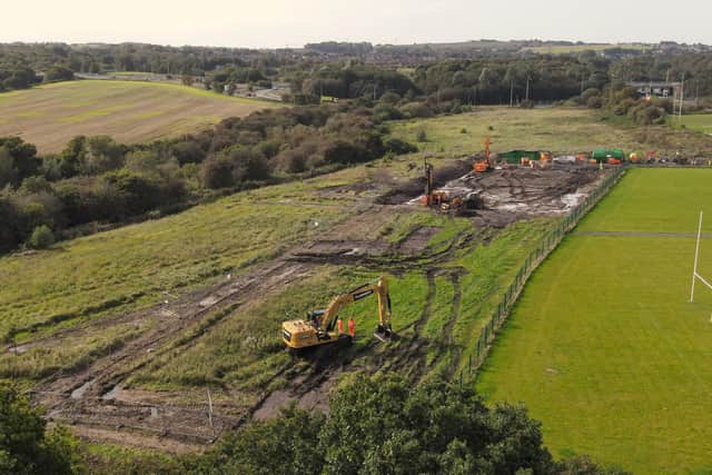 Excavators on land near the M58/M6 junction and St James's rugby fields