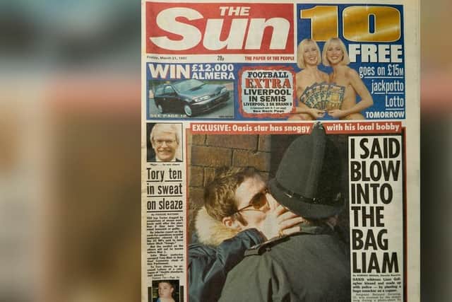 The famous Wigan Evening Post picture of Liam Gallagher kissing a police officer which adorned the front page of The Sun and went to media around the world