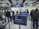 Border Force check the passports of passengers arriving. Photo: Getty Images