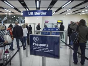 Border Force check the passports of passengers arriving. Photo: Getty Images