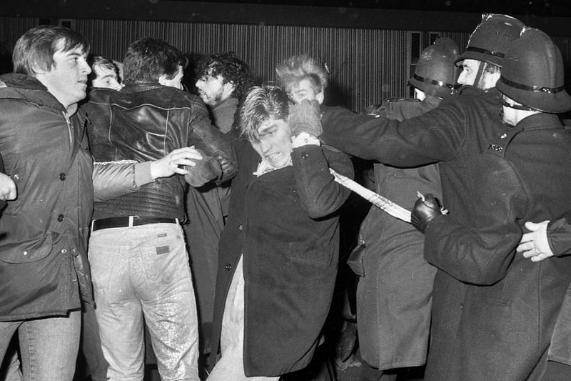 Poilce clash with pickets during the Stockport Messenger dispute at Winwick Quay, Warrington, on Tuesday 29th of November 1983.
The dispute was between the Stockport Messenger Group proprietor Eddie Shah and the National Graphical Association over closed shop agreements. It went on over several nights as the pickets attempted to stop production of the newspapers.   Wigan photographers were sent from Wigan to cover the dispute because it had wider implications within the newspaper industry.