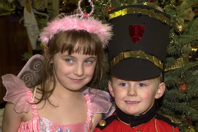 STARS IN WAITING: Nervous four-year-olds, Yoland and Jack wait for theoir curtain callJ during this year's annual festive production at  RL Hughes School, Ashton, 2004