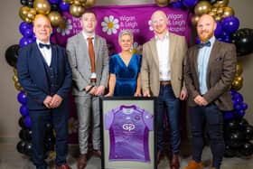 Wigan & Leigh Hospice Chief Executive Jo Carby with Wigan Warriors players Liam Farrell and Jake Wardell, and Liam Marshall's dad David and brother Scott.