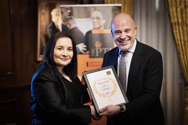 Katie Williams from Winstanley College receiving her high commended award certificate from Sir Jon Coles, chief executive of United Learning and a member of the Bernice McCabe Award judging panel