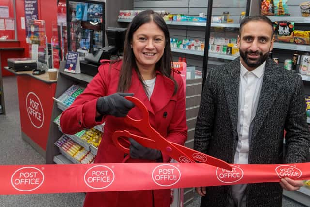 Wigan MP Lisa Nandy at the new post office with postmaster Arif Matadar